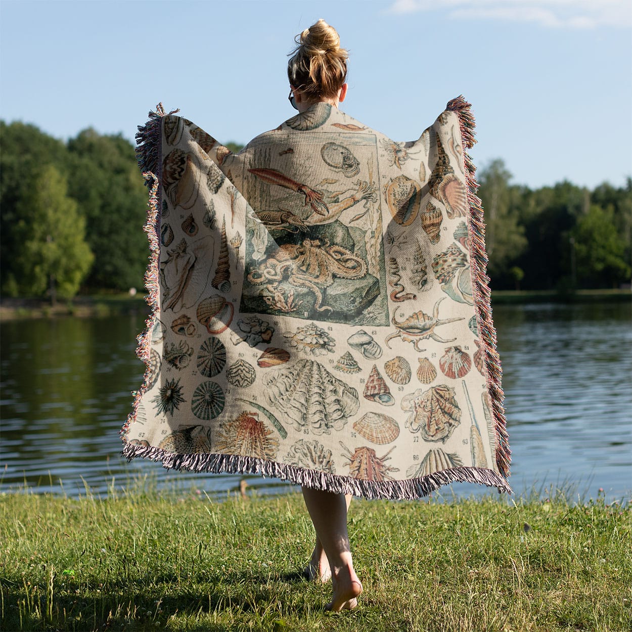 Seashells Woven Blanket Held on a Woman's Back Outside