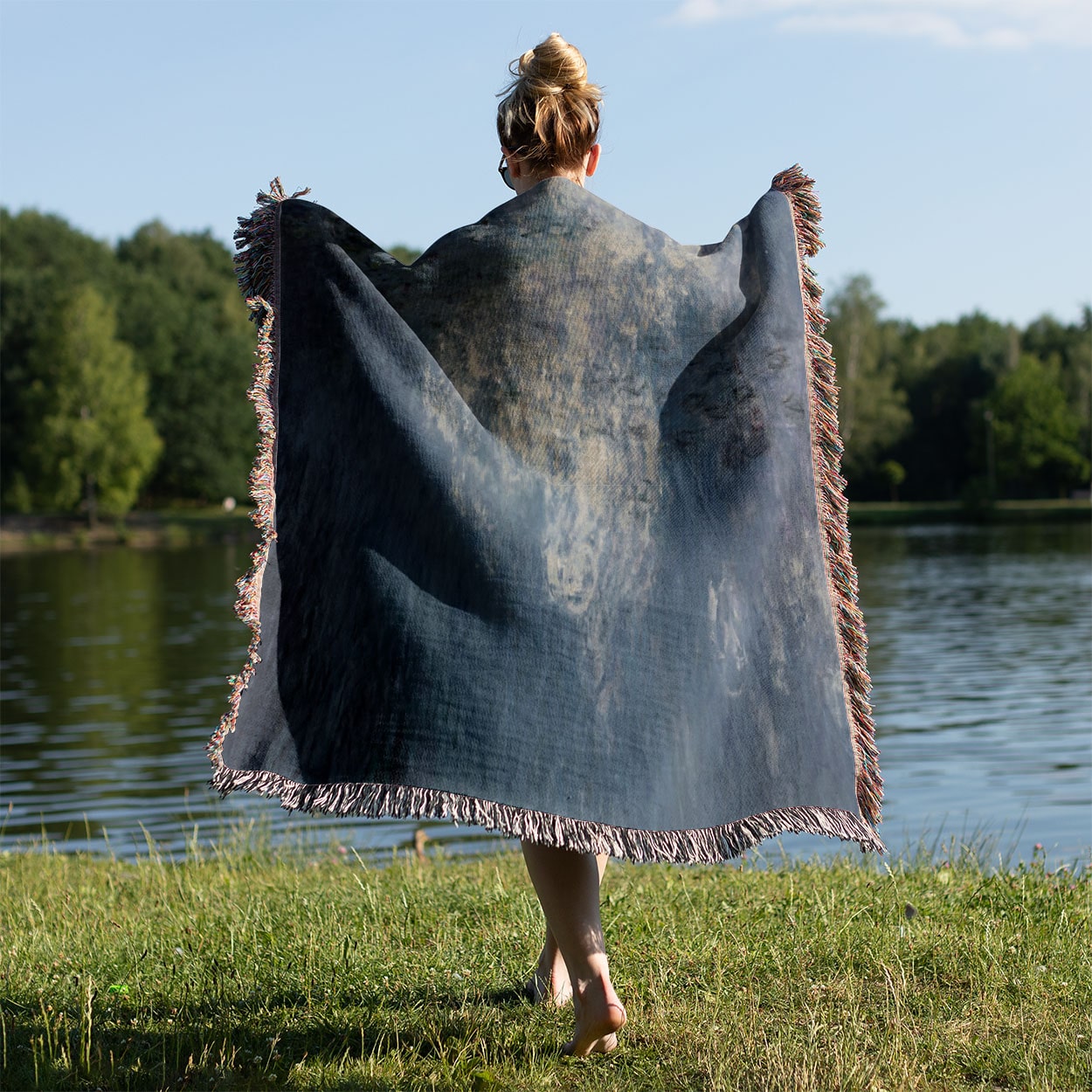 Serene Peaceful Woven Blanket Held on a Woman's Back Outside