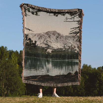Snowy Mountains Woven Blanket Held Up Outside