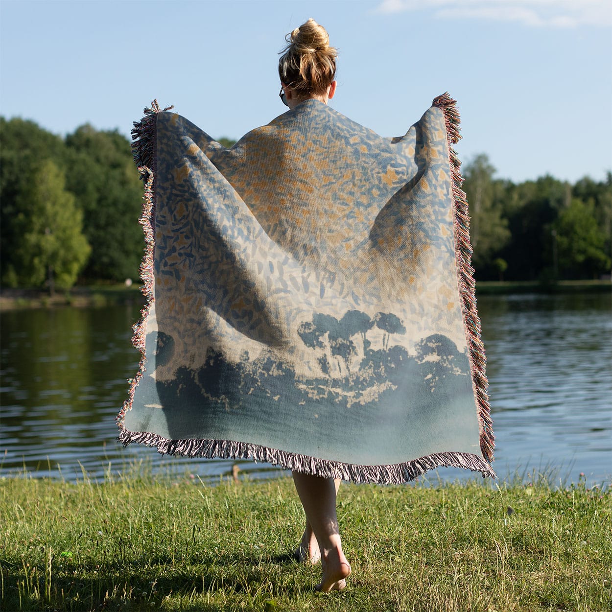 Starry Sky Woven Blanket Held on a Woman's Back Outside