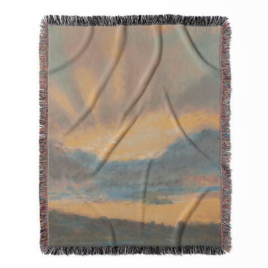 Sun in the Clouds woven throw blanket, crafted from 100% cotton, providing a soft and cozy texture with a yellow and blue design for home decor.