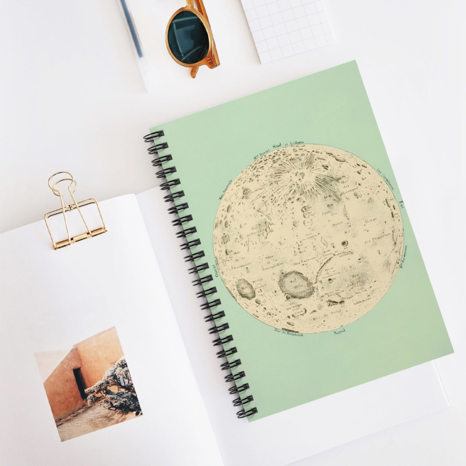 Teal Moon Spiral Notebook Displayed on Desk