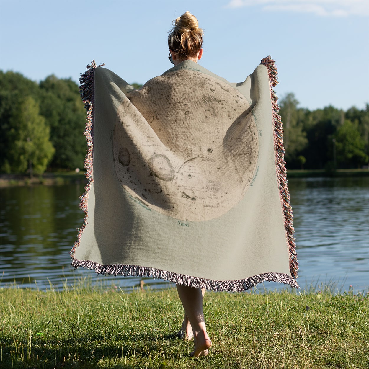 Teal Moon Held on a Woman's Back Outside