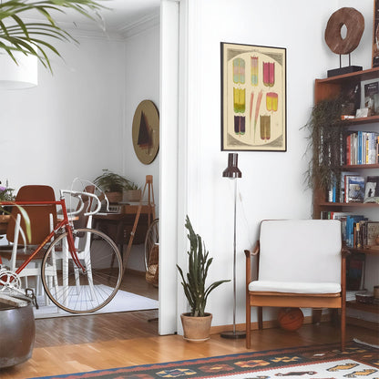 Eclectic living room with a road bike, bookshelf and house plants that features framed artwork of a Abstract Colorful Nature above a chair and lamp