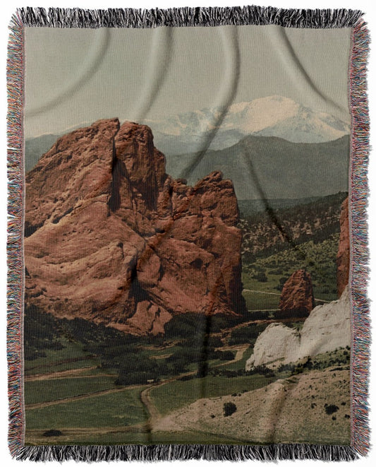 The Gateway woven throw blanket, constructed from 100% cotton, offering a soft and cozy texture with a garden of the gods theme for home decor.