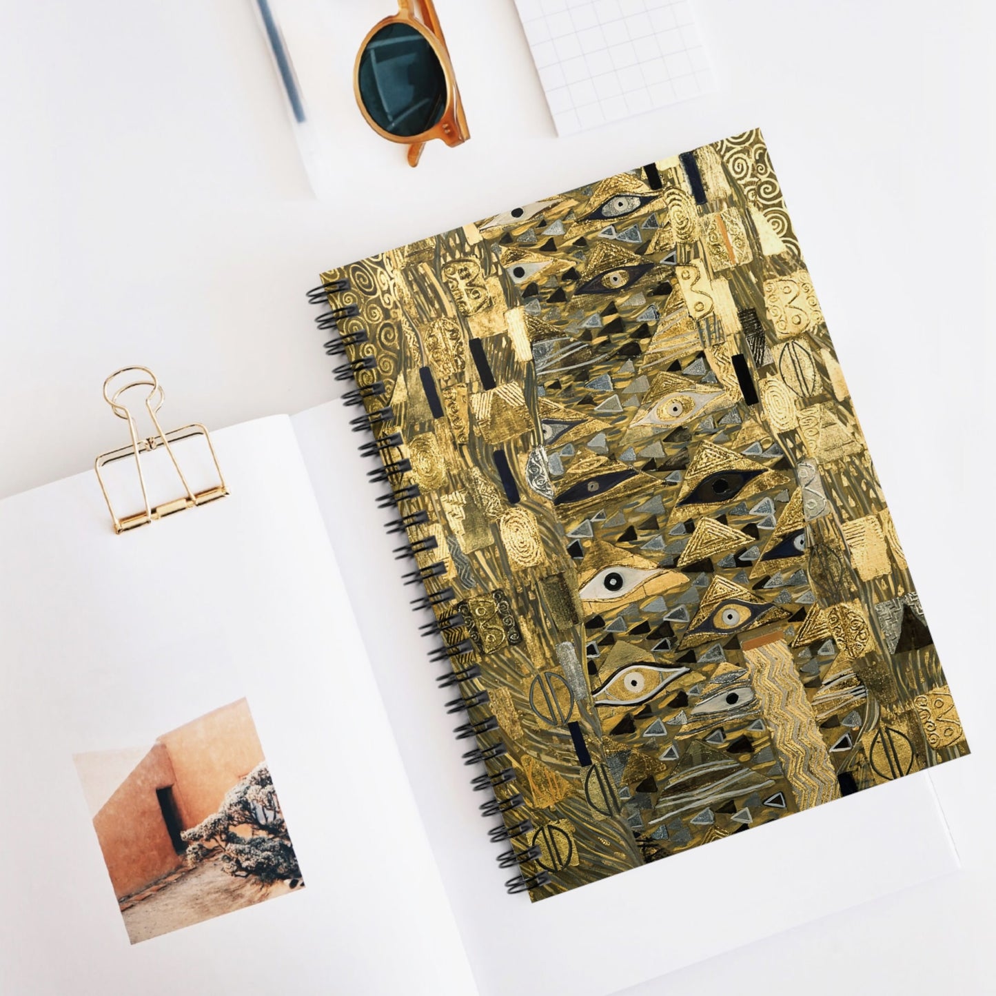 The Lady in Gold Spiral Notebook Displayed on Desk