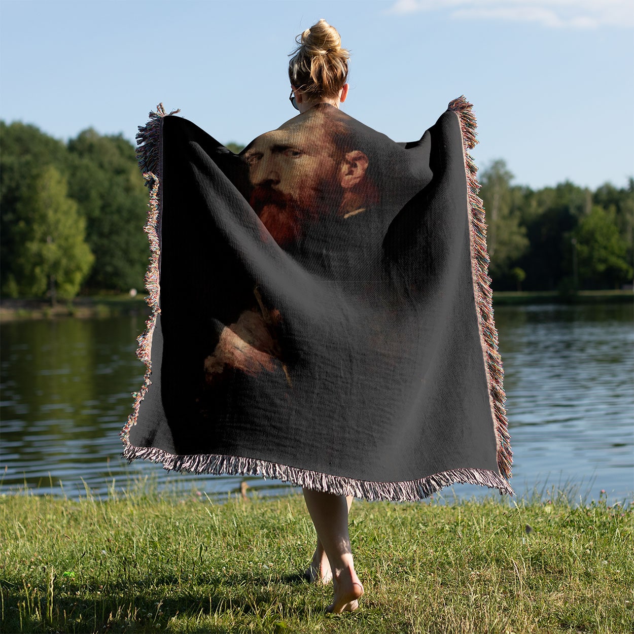 The Painter Woven Blanket Held on a Woman's Back Outside