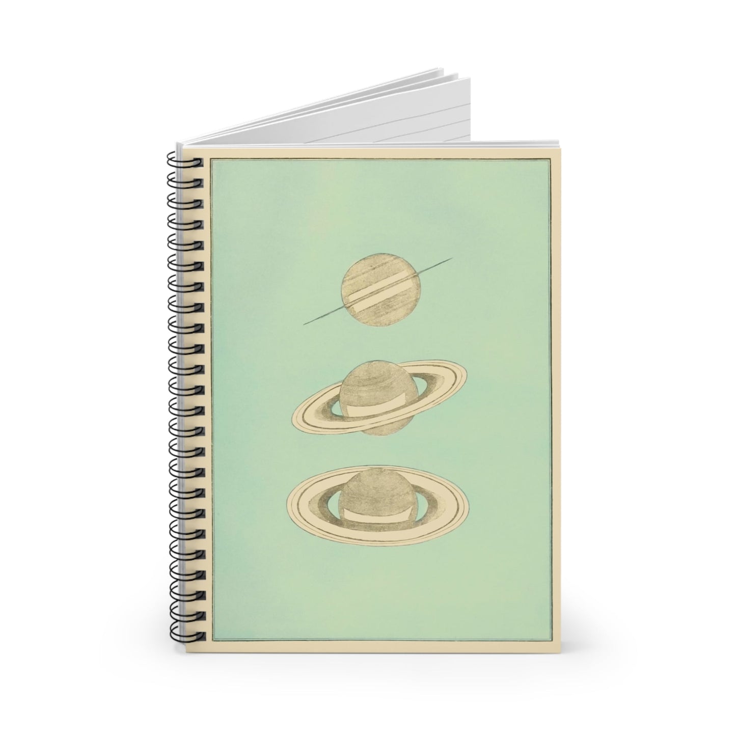 The Rings of Saturn Spiral Notebook Standing up on White Desk