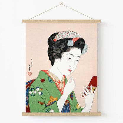 Geisha Applying Lipstick Art Print in Wood Hanger Frame on Wall