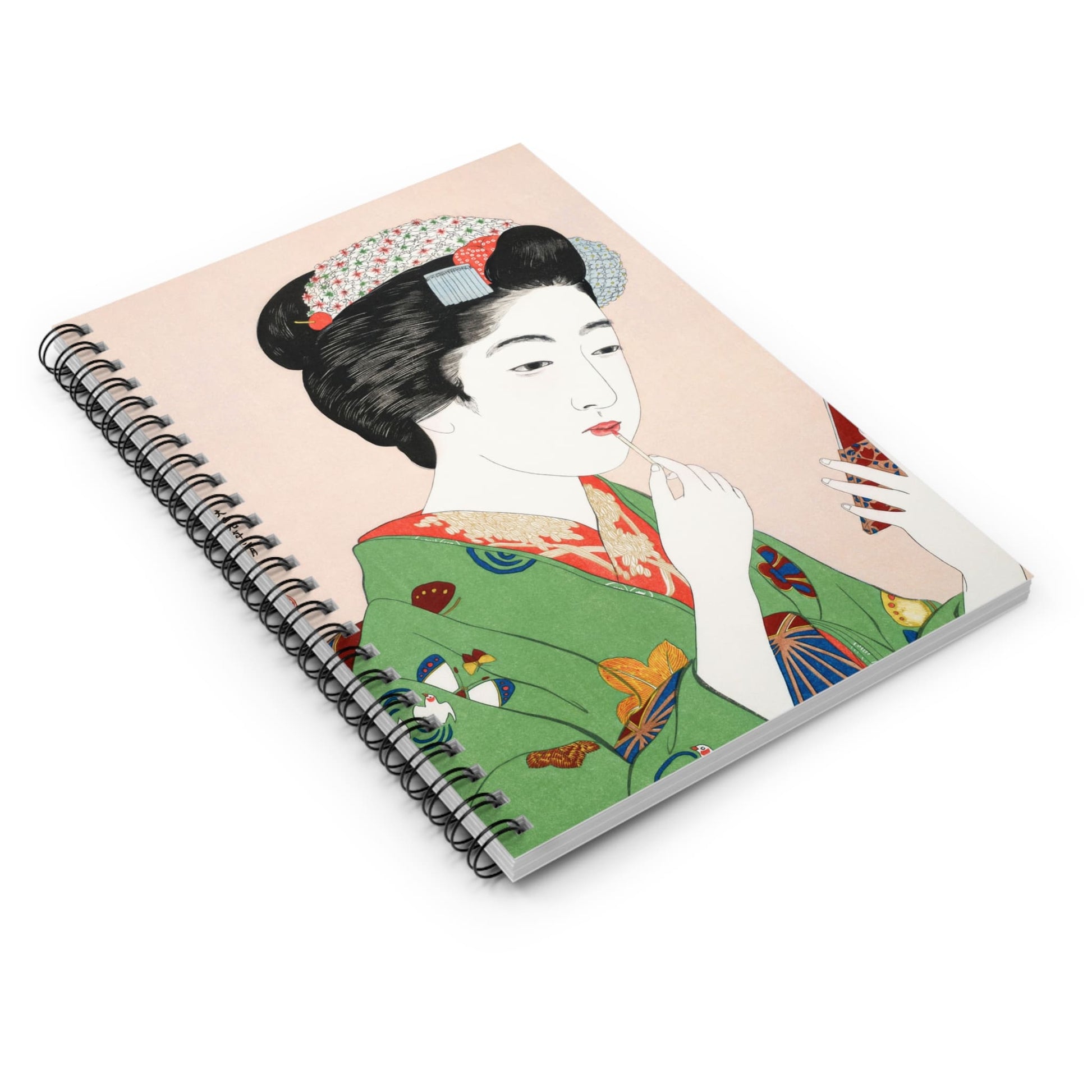 Traditional Japanese Spiral Notebook Laying Flat on White Surface