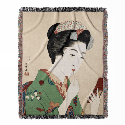 Traditional Japanese woven throw blanket, made of 100% cotton, featuring a soft and cozy texture with a woman applying lipstick for home decor.