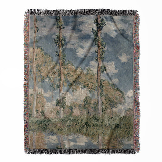 Tranquil Nature woven throw blanket, made of 100% cotton, providing a soft and cozy texture with a trees and sky design for home decor.