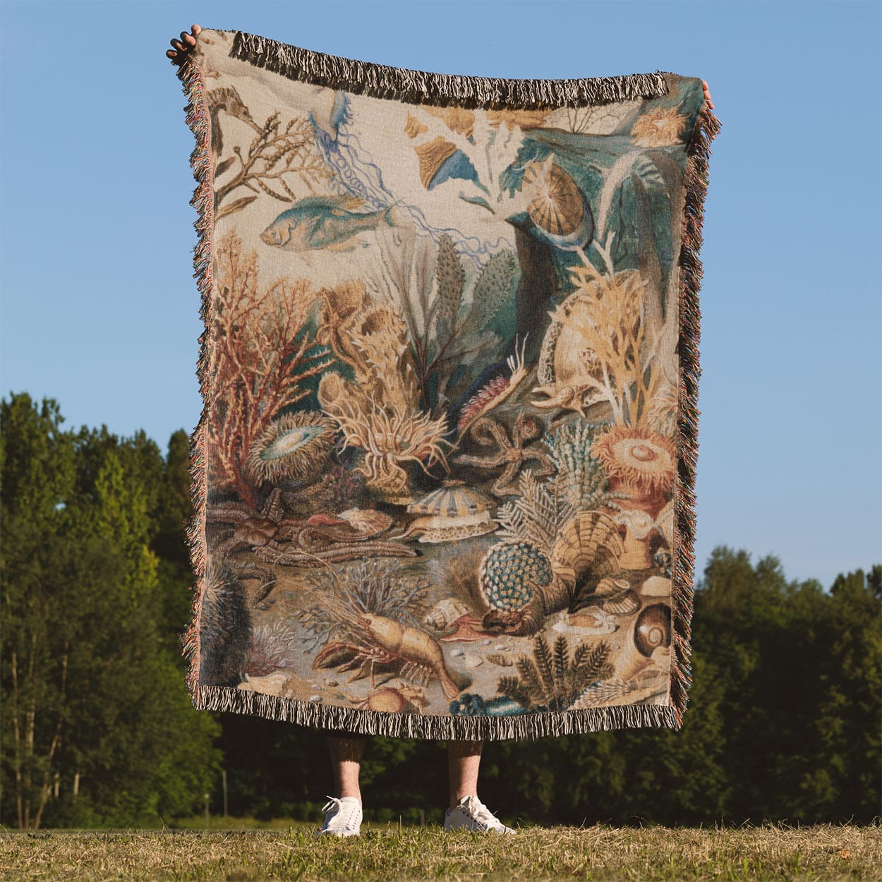 Under the Sea Woven Throw Blanket Held Up Outside