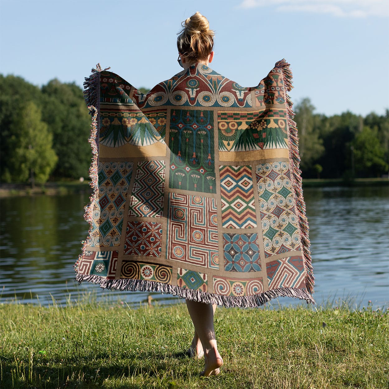 Unique Designs Woven Blanket Held on a Woman's Back Outside