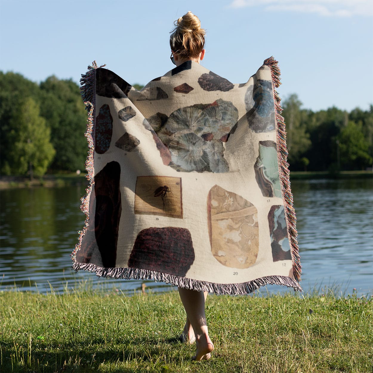 Unique Gemstone Woven Blanket Held on a Woman's Back Outside