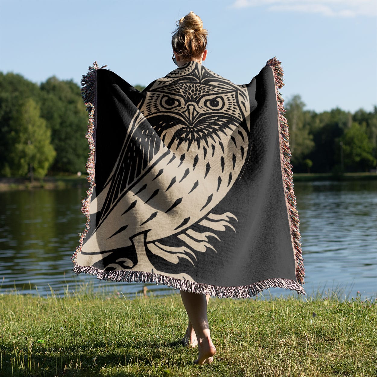 Unique Owl Woven Blanket Held on a Woman's Back Outside