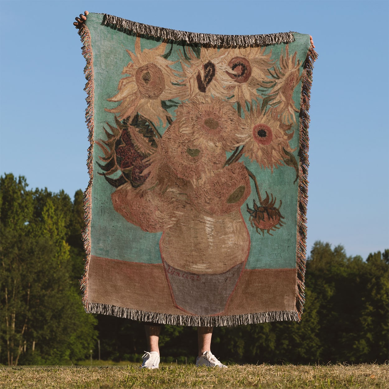 Vase with Flowers Woven Blanket Held Up Outside