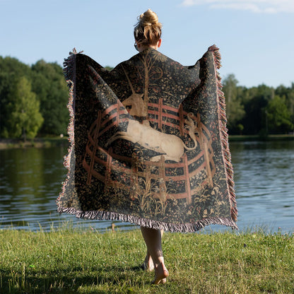 Vintage Unicorn Woven Blanket Held on a Woman's Back Outside
