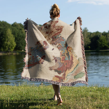 Vintage United Kingdom Map Woven Blanket Held on a Woman's Back Outside