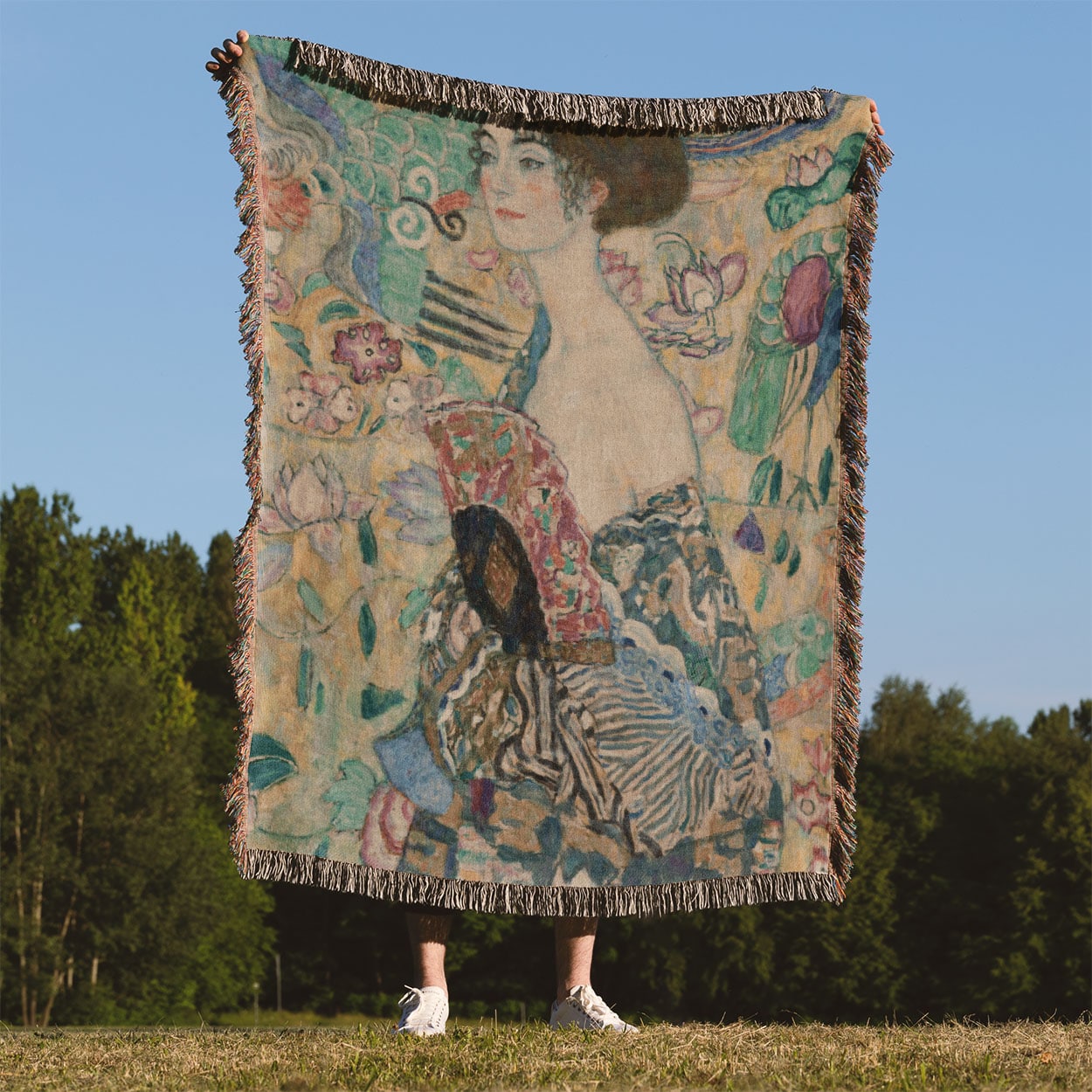 Whimsical Woven Blanket Held Up Outside