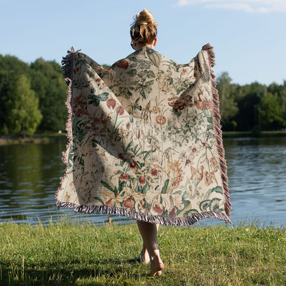 Wildflower and Plants Woven Blanket Held on a Woman's Back Outside