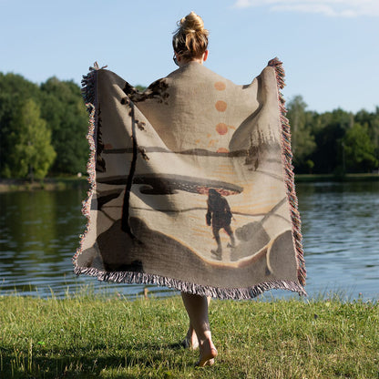Winter Journey Woven Blanket Held on a Woman's Back Outside