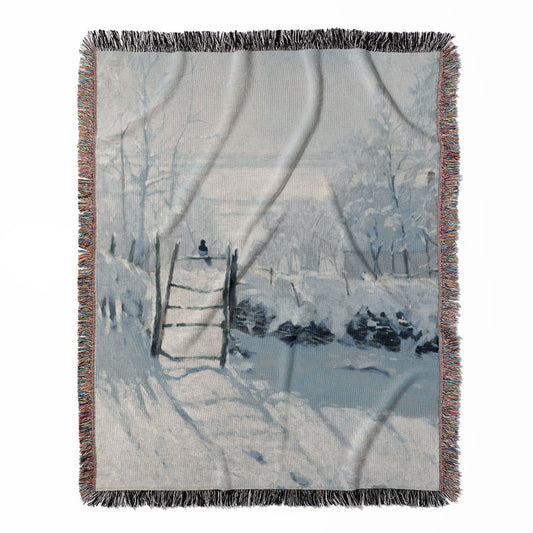 Winter woven throw blanket, made with 100% cotton, featuring a soft and cozy texture with a snowy winter landscape for home decor.
