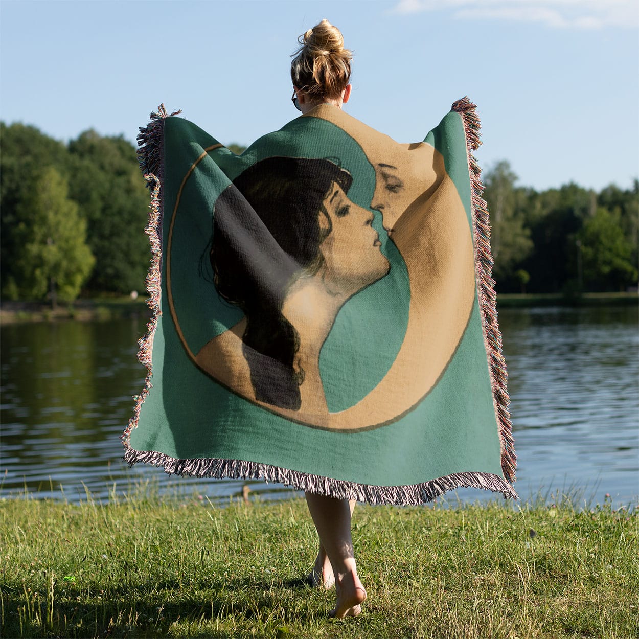 Woman Kissing the Moon Woven Blanket Held on a Woman's Back Outside