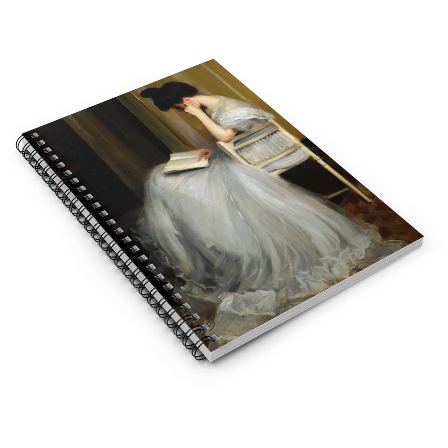 Woman Reading Spiral Notebook Laying Flat on White Surface