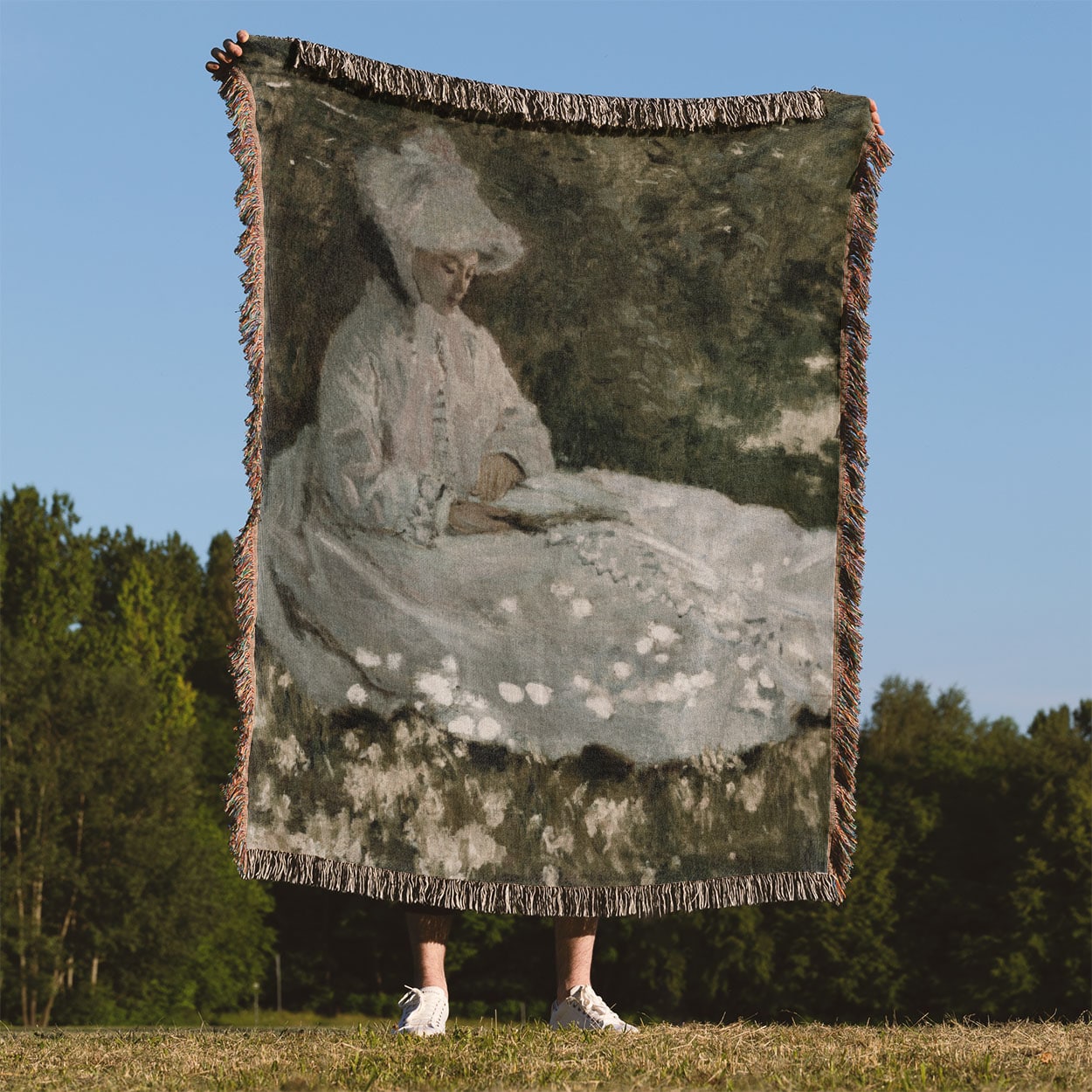 Woman in a White Dress Woven Blanket Held Up Outside