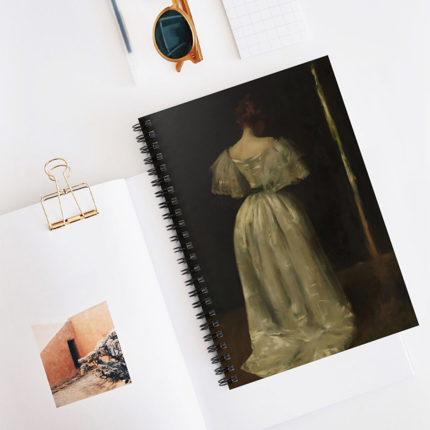 Woman in a White Dress Spiral Notebook Displayed on Desk