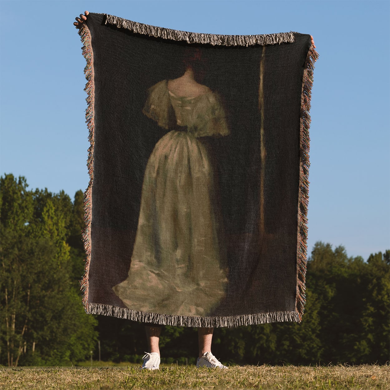 Woman in a White Dress Woven Blanket Held Up Outside
