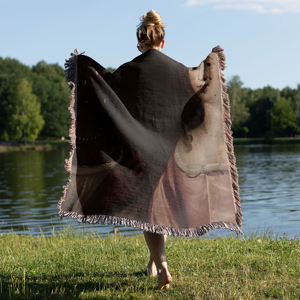 Renaissance Woven Blanket Held on a Woman's Back Outside